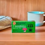 3 Ballerina cinnamon flavor herbal tea box on wooden shelf with tea cup