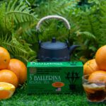3 Ballerina orange flavor herbal tea box with fresh oranges teapot and brewed tea